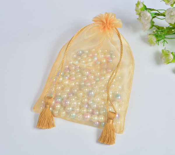golden organza gift bag with tassels drawstring