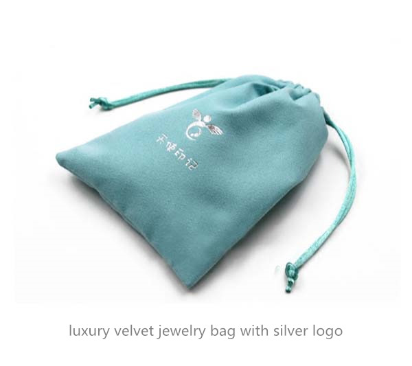 luxury velvet jewelry bag with silver logo