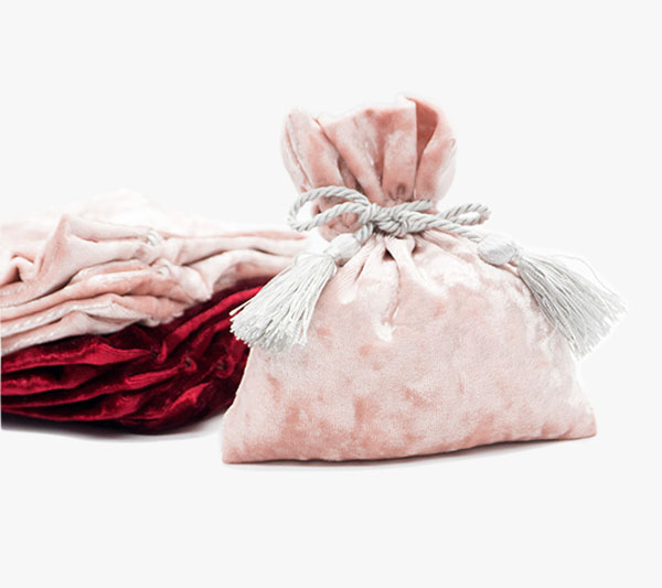 pink velour cosmetics pouch with tassels decoration