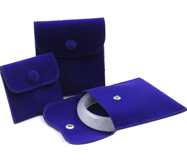 royal blue velvet jewelry bag with button closure