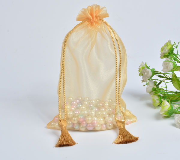 golden organza gift bag with tassels drawstring