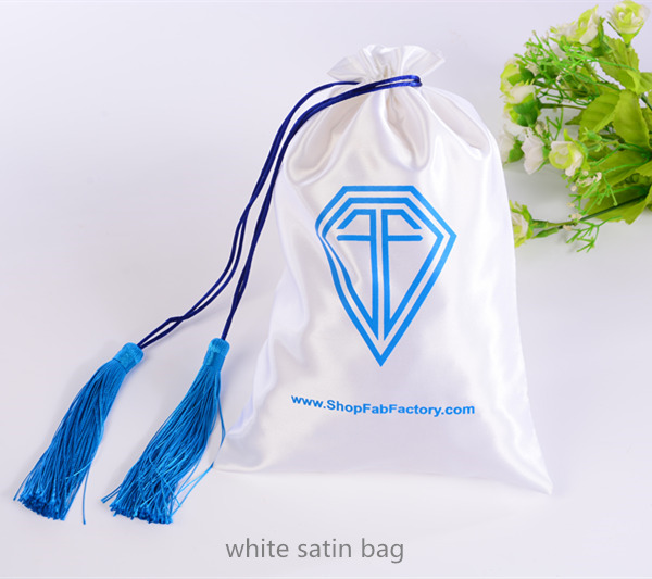 white satin bag with tassels