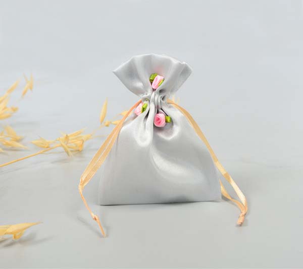 small satin jewelry pouch with flowers drawstring