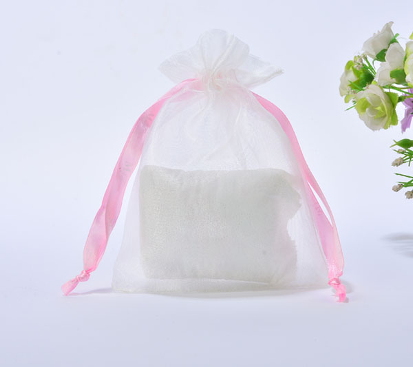 white organza jewelry pouch with pink silk ribbon drawstring rope