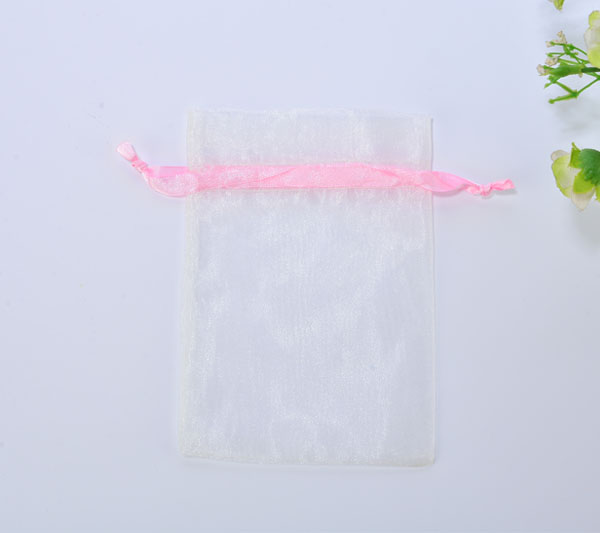 white organza jewelry pouch with pink silk ribbon drawstring rope